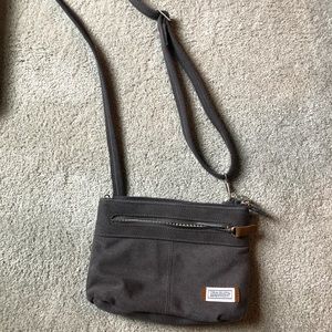 Never used cross body Travelon lockable purse
